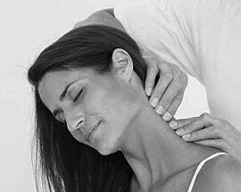 A woman is holding the neck of another person.
